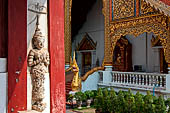 Chiang Mai - The Wat Phra Singh temple. Detail of the facade of the ubosot with the vihan in the background. 